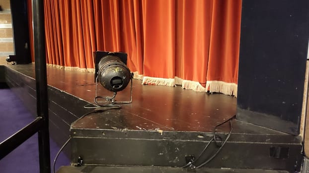 theater stage, red curtain, lamp, footlights, room, interior objects. High quality photo