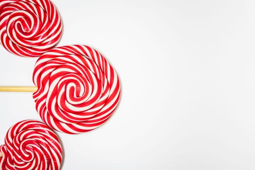 Christmas lollipops on a white background. Christmas candy. Background for Christmas related things.