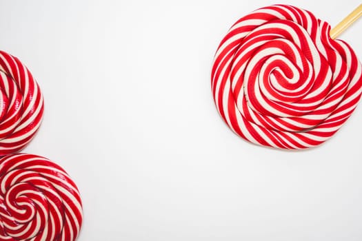 Christmas lollipops on a white background. Christmas candy. Background for Christmas related things.