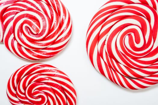 Christmas lollipops on a white background. Christmas candy. Background for Christmas related things.