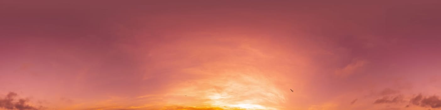 Dramatic Sunset sky 360 panorama. Vibrant sky with bright glowing red pink Cumulus clouds. HDR 360 seamless spherical panorama. Sky dome for aerial drone panoramas. Climate and weather change