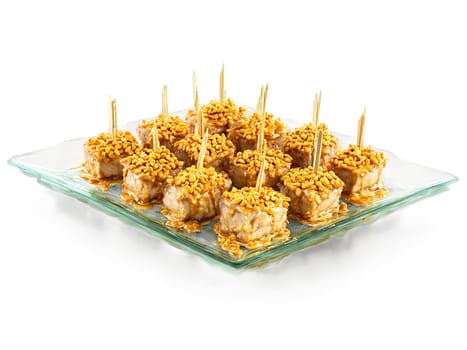 Canapes chicken satay with peanut sauce served on a transparent glass tray Asian inspired. Food isolated on transparent background.