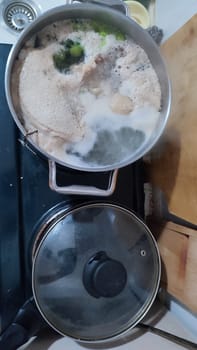 chicken leg in a saucepan for broth, food lunch cooking preparation dinner, products. High quality photo