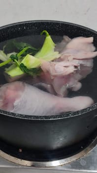 chicken leg in a saucepan for broth, food lunch cooking preparation dinner, products. High quality photo