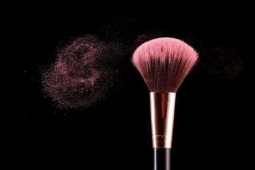A conceptual photo of an applicator brush with dust coming off it.