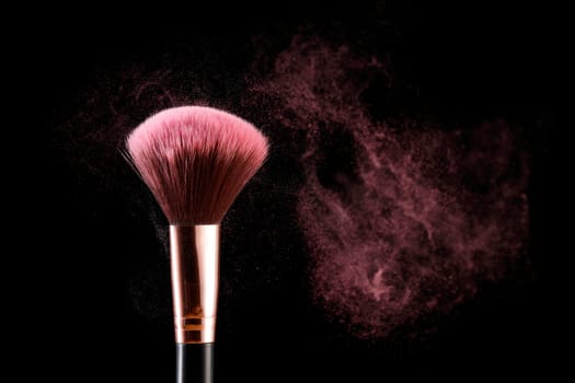 A conceptual photo of an applicator brush with dust coming off it.