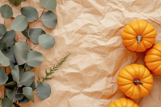 A beautiful arrangement showcases various pumpkins, cotton bolls, pinecones, and eucalyptus leaves framed on a soft background, reflecting the essence of autumn.