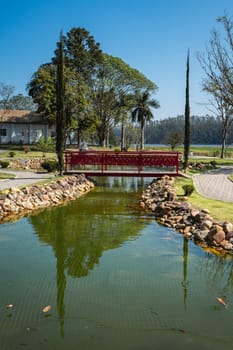 Ribeirão Pires, SP Brazil. August 29, 2024.
Beautiful Bridge and pond in the Oriental  Park. Milton Marinho De Moraes.