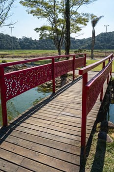 Ribeirão Pires, SP Brazil. August 29, 2024.
Beautiful Bridge and pond in the Oriental  Park. Milton Marinho De Moraes.
