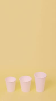 Take away a cup of coffee on orange paper background.