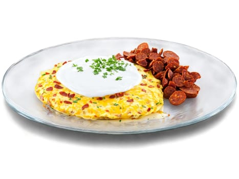 Omelette chorizo and potato with a dollop of sour cream on a transparent glass plate. Food isolated on transparent background.