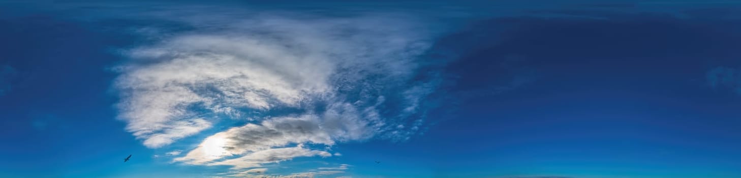 Blue sky with Cirrus clouds Seamless panorama in spherical equirectangular format. Complete zenith for use in 3D graphics, game and for composites in aerial drone 360 degree panoramas as a sky dome.