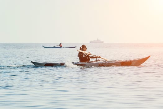 Happy smiling woman in kayak on ocean, paddling with wooden oar. Calm sea water and horizon in background