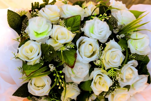 Decorative decorated bouquet of white roses close-up.