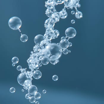 Bubbles ascend gracefully through a tranquil blue backdrop, capturing the beauty of underwater movement and the play of light in a calm aquatic setting.