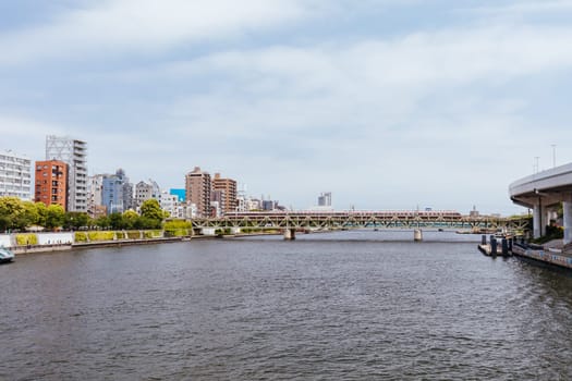 Sumida River from Azuma Bridge on a clear spring day in Azumabashi district of Sumida City in Tokyo, Japan