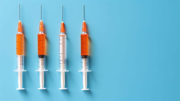 Vaccine syringes on blue background, top view with room for text, optimal for search relevance