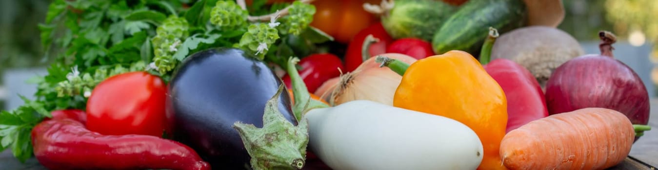 fresh vegetables on a wooden background in a paper bag. Selective focus.