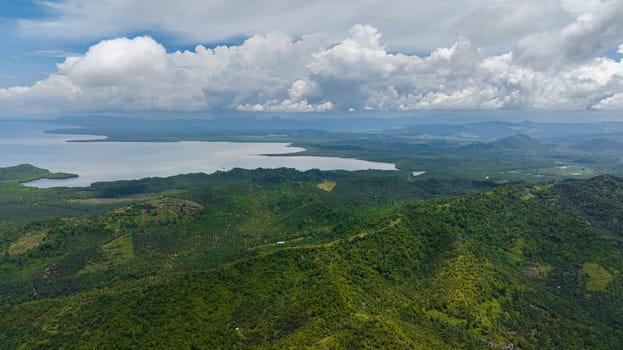 Aerial view of coast of the island of Borneo with palm oil plantations and jungle. Malaysia.