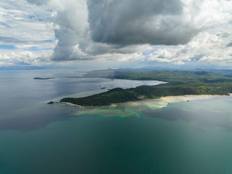 Aerial view of coastline of Borneo island with beach and jungle. Malaysia.
