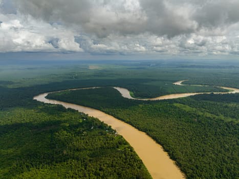 Aerial view of Kinabatangan river among the rainforest and jungle. Borneo, Malaysia.