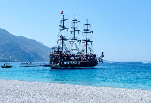 Wooden yacht with clear blue water, Tourist boats at the Oludeniz beach in Fethiye district in Turkey.