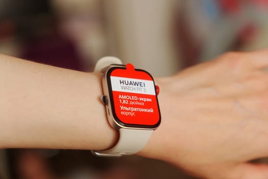 Tyumen, Russia-June 20, 2024: Sleek White Huawei Watch Fit 3 on a Wrist