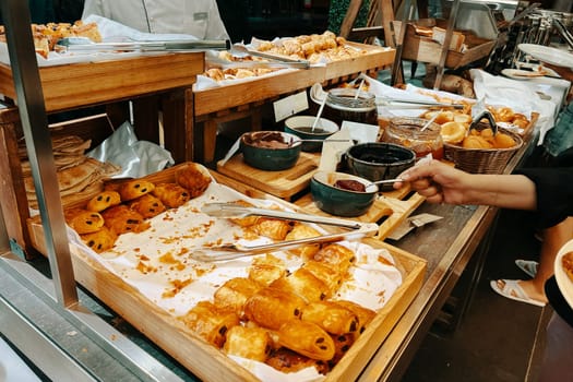 An assortment of freshly baked pastries, crunchy morning croissants, and a hotel breakfast buffet.