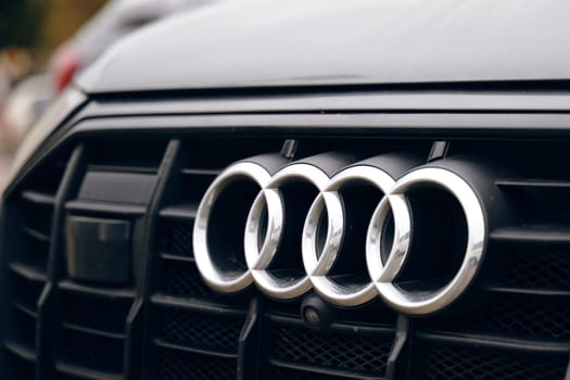 A close-range photo emphasizing the Audi logo on the vehicle's hood. BISHKEK, KYRGYZ REPUBLIC - 26 SEPTEMBER 2021