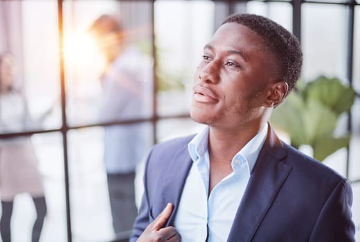 Pensive mixed race confident international company employee manager thinking of problem solution at office.