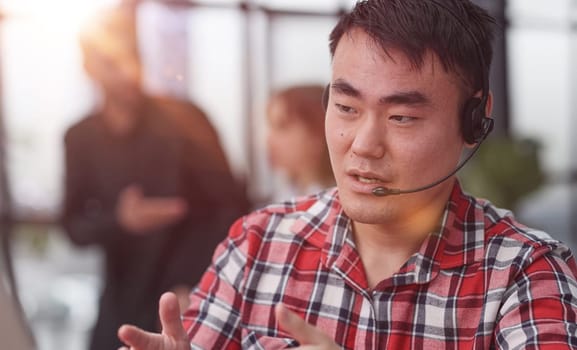 business man wearing headset for video conference, communication and education, male study and learning for e-learning.