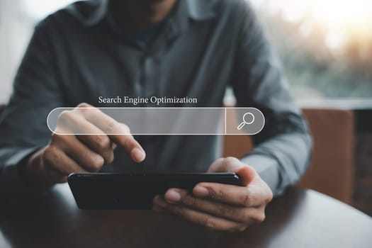 Businessman using smartphone to optimize online content with SEO tools. Technology and business concept. search engine optimization with search bar