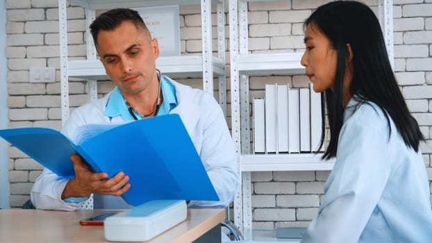 Doctor in professional uniform examining patient at hospital or medical clinic. Health care , medical and doctor staff service concept. Jivy