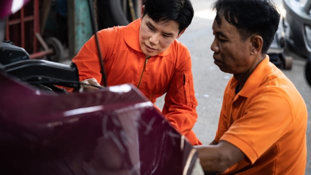 Panoramic banner automotive service mechanic inspect and diagnose car engine issue, repairing and fixing problem in workshop. Technician car care maintenance working on internal components. Oxus