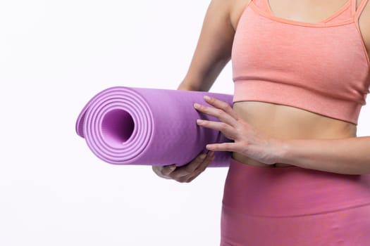 Young attractive asian woman portrait in sportswear with exercising mat. Healthy exercise and workout routine lifestyle concept. Studio shot isolated background. Vigorous