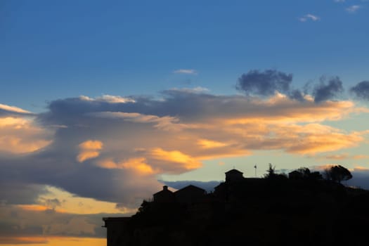 Northern Greece. Rock monastery in Thessaly. Amazing clouds and silhouettes of monastery buildings