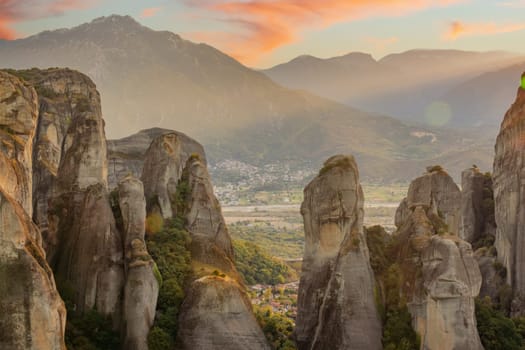 Greece. Sunny summer evening in the mountains of Thessaly. Majestic rocky mountains. Sunset clouds over the mountain ranges