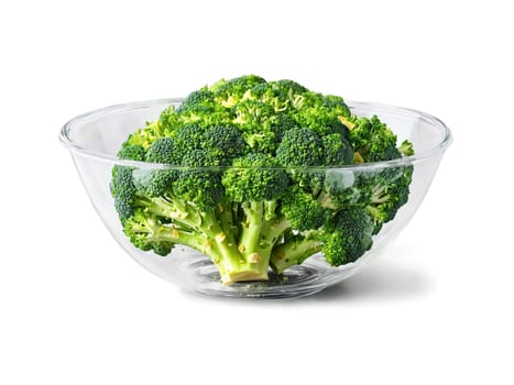 Broccoli steamed and garnished with lemon zest served in a transparent glass bowl green. Food isolated on transparent background.