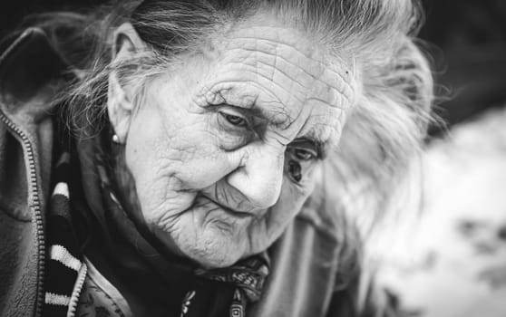 Black and white portrait of very old tired woman in depression. Old woman. 