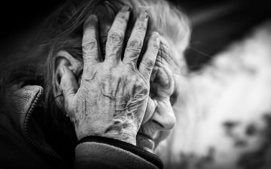 Black and white portrait of very old tired woman in depression. Old woman. 