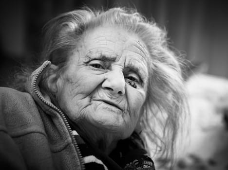 Black and white portrait of very old tired woman in depression. Old woman. 