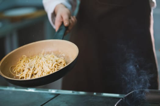 Process of cooking spaghetti with sauce close-up
