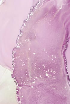 This captivating marbled texture features a blend of soft purple hues and subtle glittering accents, evoking a serene atmosphere ideal for home decor or art inspiration.