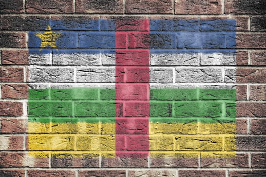 A Central African Republic flag on a brick wall background
