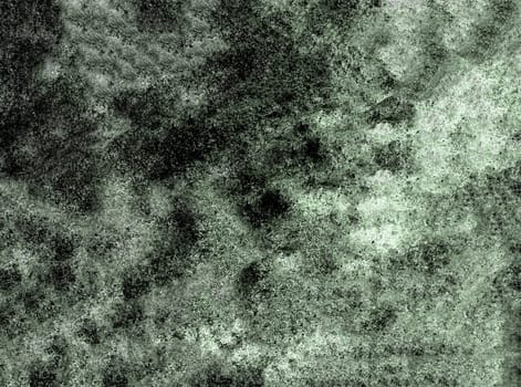 Grunge background of a mottled rough monochrome surface in close-up