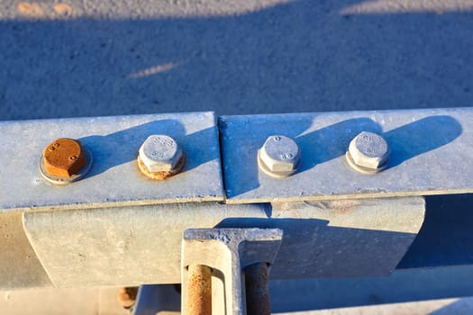 nuts and bolts on an old metal bridge. Anchor bolts. The design.