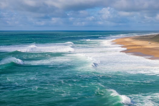 Nazare 's North beach (Praia do Norte, Nazare). World record of biggest wave. Beach with rough sea.