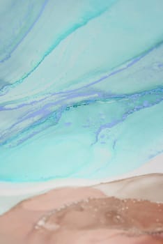 Vibrant swirls of turquoise and pastel peach blend seamlessly, revealing organic patterns that evoke a sense of calm and creativity, perfect for modern decor.