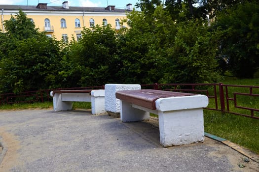 old concrete benches in the yard. a place for the elderly to relax