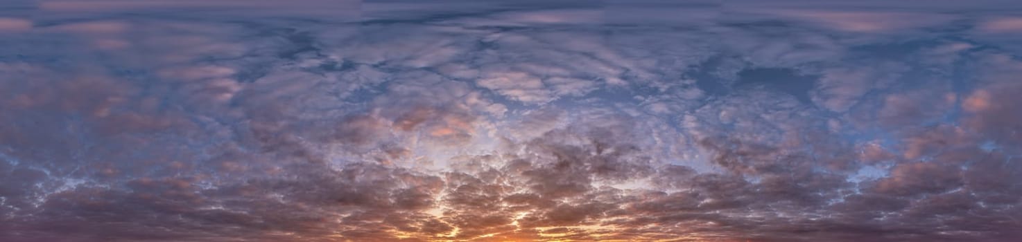 Golden sunset sky panorama Seamless spherical equirectangular 360-degree view with beautiful Stratocumulus clouds, setting sun - for use in 3D graphics as a sky dome or post-processing of drone images.